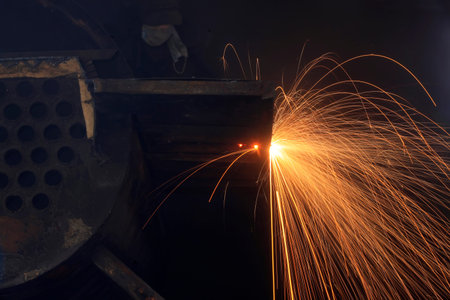 The workshop welder cuts metal