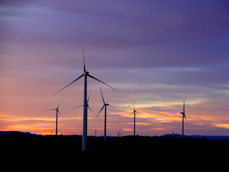 In the evening, the silhouette of wind turbines