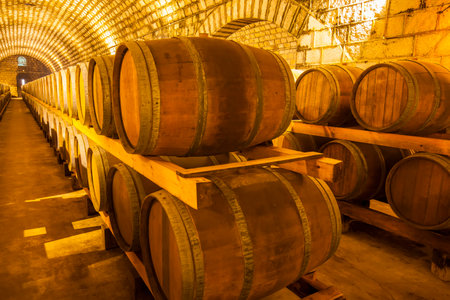 Wine barrels stacked in the cellar of the wineryのeditorial素材
