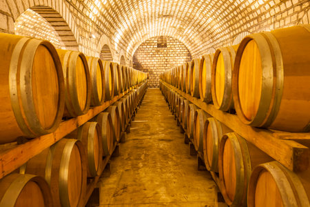 Wine barrels stacked in the cellar of the wineryのeditorial素材