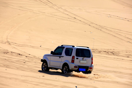 An suv was driving in the desert.の写真素材