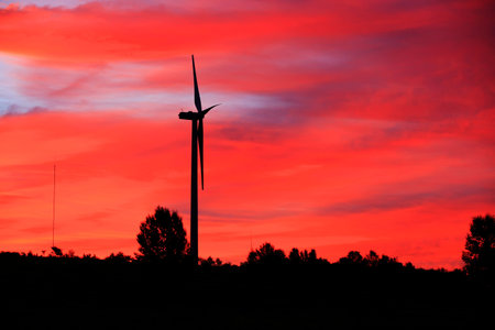 In the evening, the silhouette of wind turbines