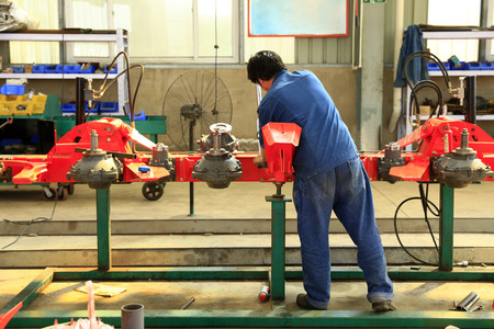 The workers work in the workshop of the factory,の写真素材