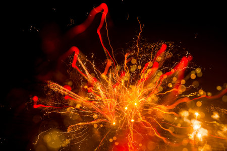 Colorful fireworks explode at night