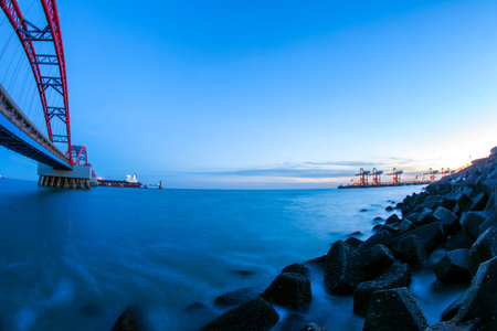 Container terminals and Bridges, cargo terminals in the evening
