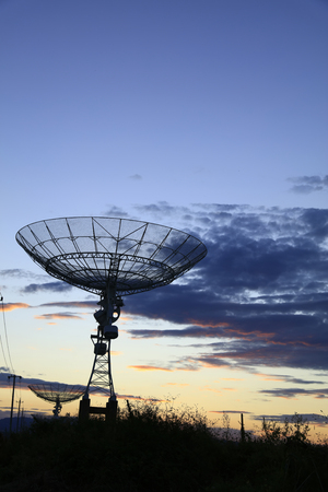 The silhouette of radio telescopeの写真素材