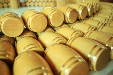 Wine barrels stacked in the cellar of the wineryの写真素材