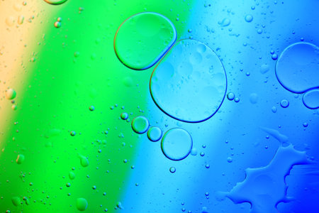 Water droplets on the glass, color background
