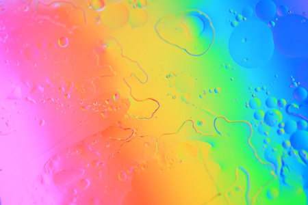 Water droplets on the glass, color background