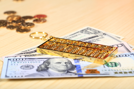 Gold abacus and the dollarの写真素材