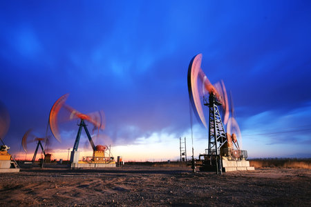 In the evening, the silhouette of the oil pump