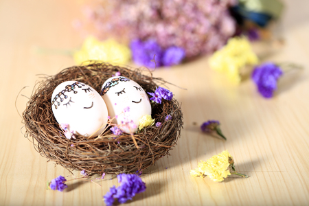 Painted eggs in the nestの写真素材