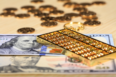 Gold abacus and the dollarの写真素材
