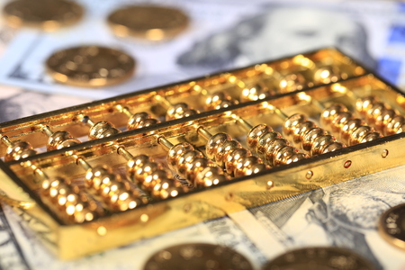 Gold abacus and the dollarの写真素材
