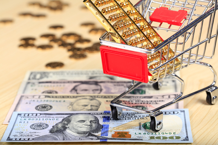 Gold abacus and the dollarの写真素材