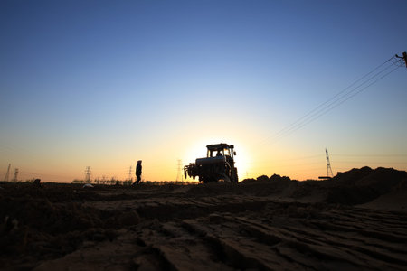 In the spring,The tractor in farmland farming
