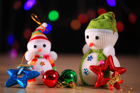 Festive snowman with Christmas light background