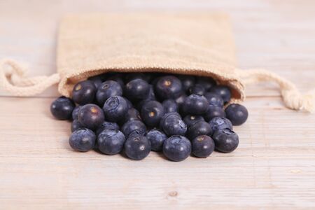 Fresh blueberries are on the tableの写真素材