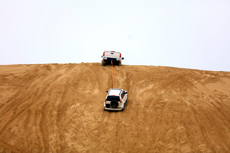 Off-road vehicle traveling in the desertの写真素材