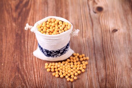 The soybean are on the wooden tableの写真素材