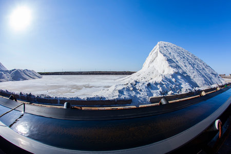 Sea salt production. machinery for the treatment of the salt, The equipment and salt stock of a salt plantの写真素材