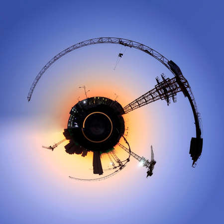 A 360-degree view of the building site is in the evening, 360-degree panorama ,Tower cranes build residential buildingsの写真素材