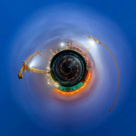 A 360-degree view of the building site is in the evening, 360-degree panorama ,Tower cranes build residential buildingsの写真素材