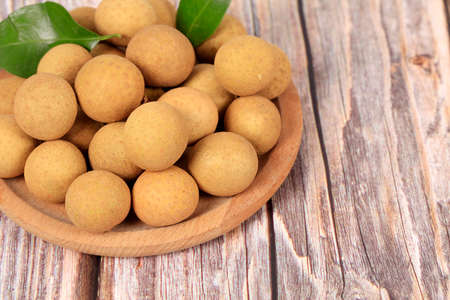 Longan are on the wooden tableの写真素材