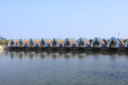 Wooden houses on the water, log cabins by the sea, places for tourists to restの写真素材