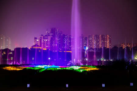 Fountains night laser show and city night scenesの写真素材