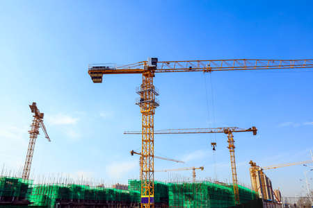 The construction site, the construction worker's tower crane, Residential buildings are under constructionの写真素材