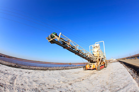 Sea salt production. machinery for the treatment of the salt, The equipment and salt stock of a salt plantの写真素材