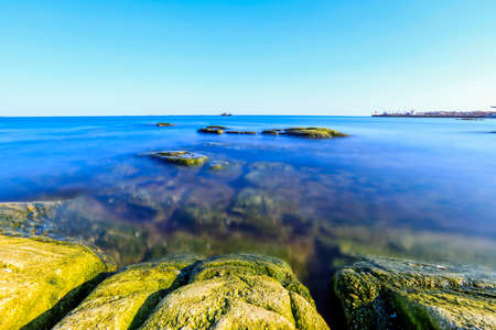 Seaside scenery, the sea under the blue sky, the rocks on the sea.の写真素材