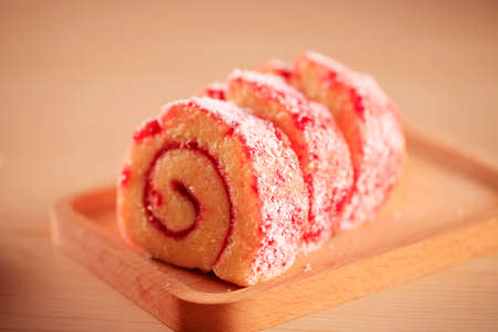 Red velvet cake on a wooden plate, close-upの写真素材