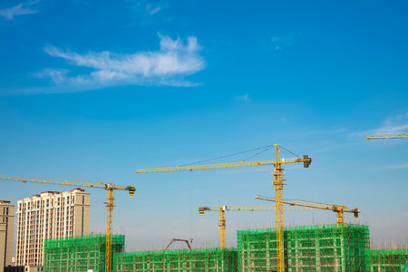 The construction site, the construction worker's tower crane, Residential buildings are under...
