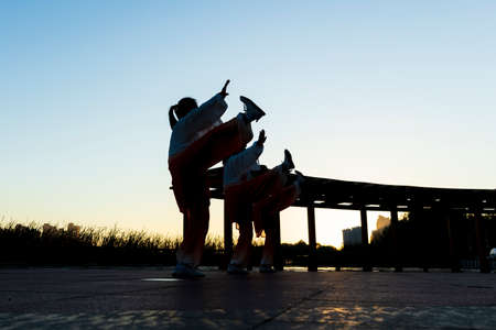 Several people practiced taijiquan, A group performs tai Chi, a Chinese martial artの写真素材