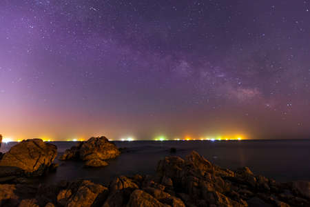 Seaside scenery, sea at night and beautiful Milky Wayの写真素材