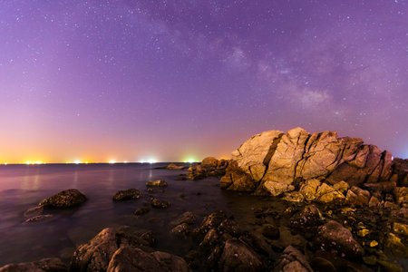 Seaside scenery, sea at night and beautiful Milky Wayの写真素材