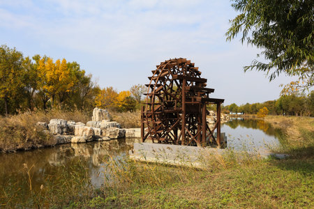 The wooden waterwheel is in the river, beautiful wooden water wheelの写真素材