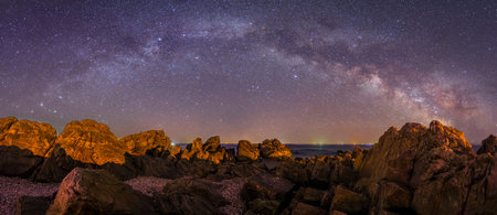 Seaside scenery, sea at night and beautiful Milky Wayの写真素材