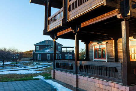 In winter, the wooden houses are under the blue sky, the beautiful wooden villas are under the blue skyの写真素材