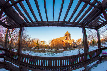 In winter, the wooden houses are under the blue sky, the beautiful wooden villas are under the blue skyの写真素材