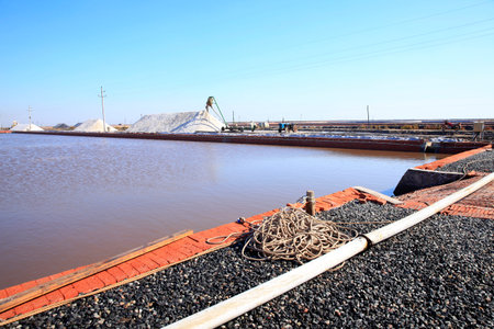 Sea salt production. machinery for the treatment of the salt, The salt making equipment in the salt farm is in operation , The equipment and salt stock of a salt plantの写真素材