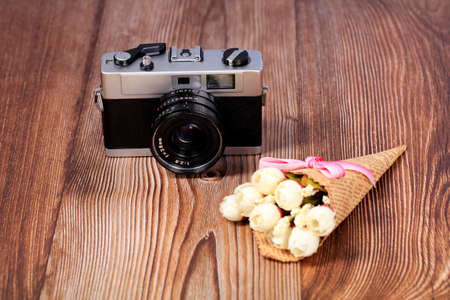 Retro camera on a wooden table, close-upの写真素材