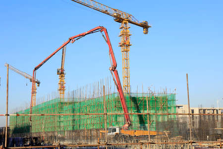 The construction site, the construction worker's tower crane, Residential buildings are under constructionの写真素材