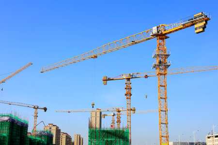 The construction site, the construction worker's tower crane, Residential buildings are under constructionの写真素材