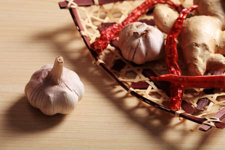 Ginger, garlic and red pepper in the bamboo basket, Studio shootingの写真素材