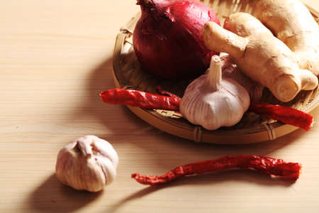 Ginger, garlic and red pepper in the bamboo basket, Studio shootingの写真素材
