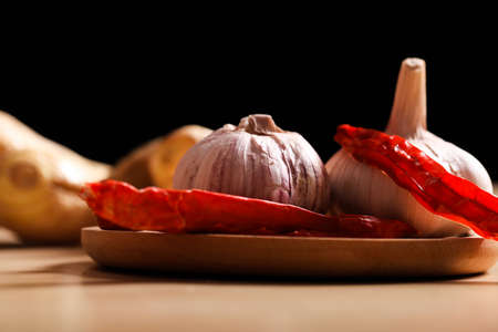 Ginger, garlic and red pepper in the bamboo basket, Studio shootingの写真素材