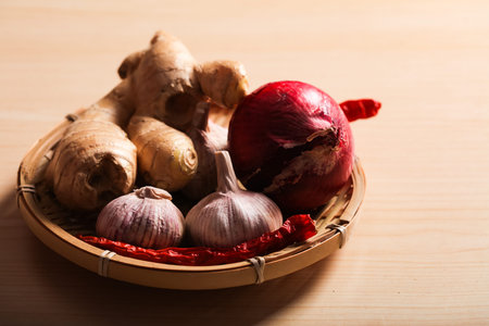 Ginger, garlic and red pepper in the bamboo basket, Studio shooting